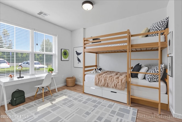 215 Sloan Ct, Matawan, NJ 07747 - bedroom with light wood finished floors and a desk