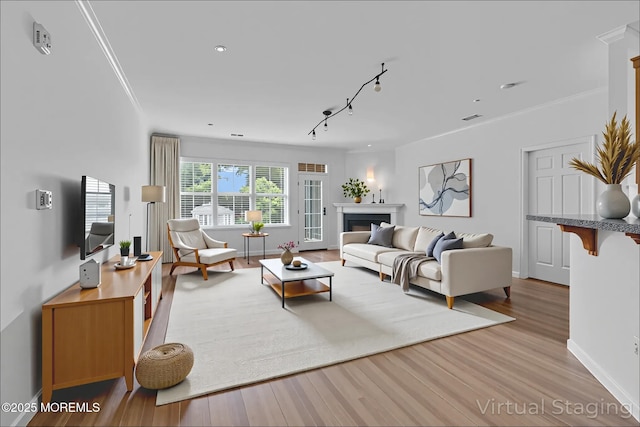 215 Sloan Ct, Matawan, NJ 07747 - living room with wood finished floors, ornamental molding, a fireplace, and recessed lighting