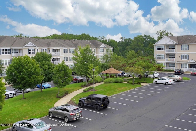 215 Sloan Ct, Matawan, NJ 07747 - uncovered parking lot with a residential view