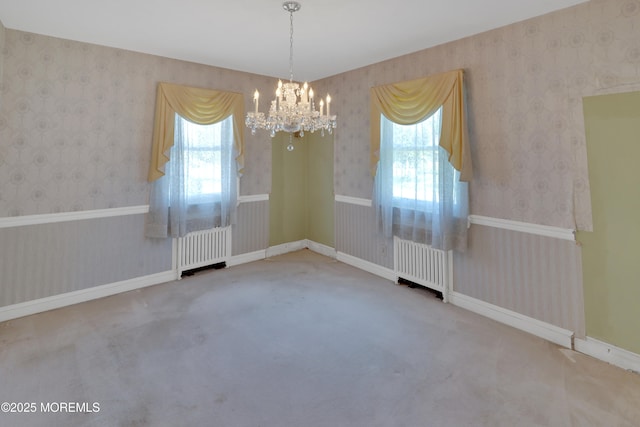 7 Tabor St, Little Silver, NJ 07739 - spare room with radiator, radiator heating unit, a chandelier, wallpapered walls, and carpet