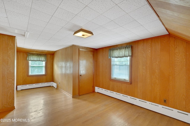7 Tabor St, Little Silver, NJ 07739 - unfurnished room with a baseboard radiator, wood finished floors, and wood walls