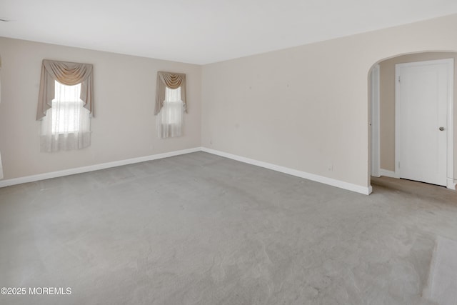 7 Tabor St, Little Silver, NJ 07739 - unfurnished room with arched walkways, carpet floors, and plenty of natural light