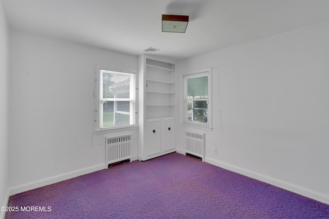 7 Tabor St, Little Silver, NJ 07739 - unfurnished room featuring radiator, dark carpet, and built in features