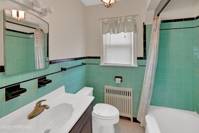 7 Tabor St, Little Silver, NJ 07739 - bathroom featuring radiator heating unit, tile patterned flooring, vanity, tile walls, and shower / tub combo with curtain