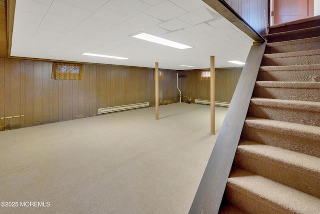 7 Tabor St, Little Silver, NJ 07739 - finished below grade area featuring a baseboard radiator, stairway, baseboard heating, carpet flooring, and wooden walls