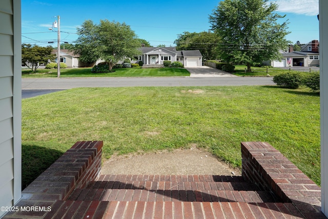 7 Tabor St, Little Silver, NJ 07739 - view of green lawn featuring driveway and a residential view