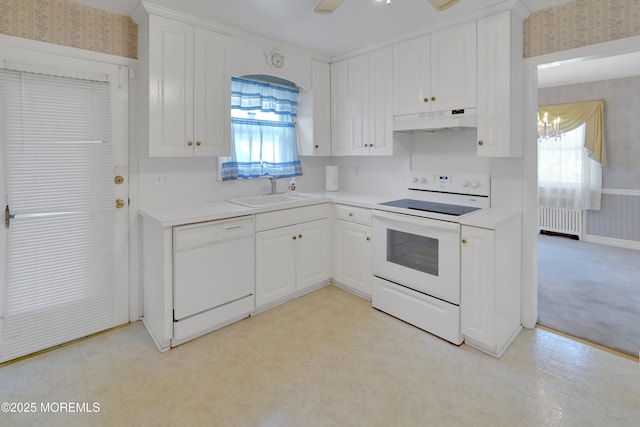 7 Tabor St, Little Silver, NJ 07739 - kitchen with wallpapered walls, white appliances, radiator, under cabinet range hood, and white cabinets
