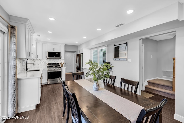 8 Blueberry Path, Howell, NJ 07731 - dining area featuring dark wood-style floors, recessed lighting, and stairway