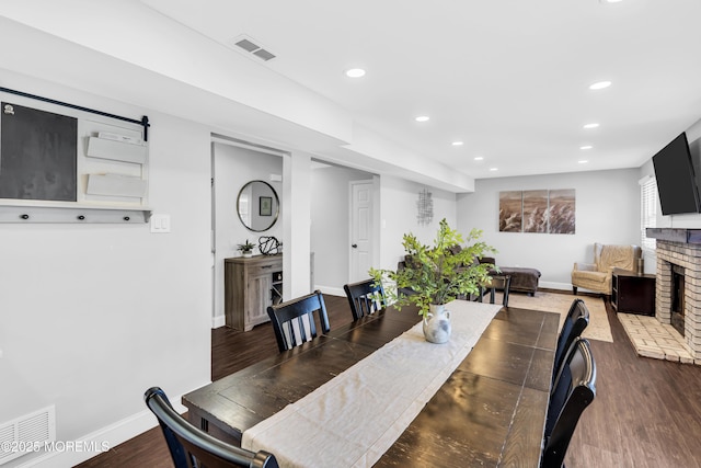 8 Blueberry Path, Howell, NJ 07731 - dining space with recessed lighting, dark wood-style floors, and a brick fireplace