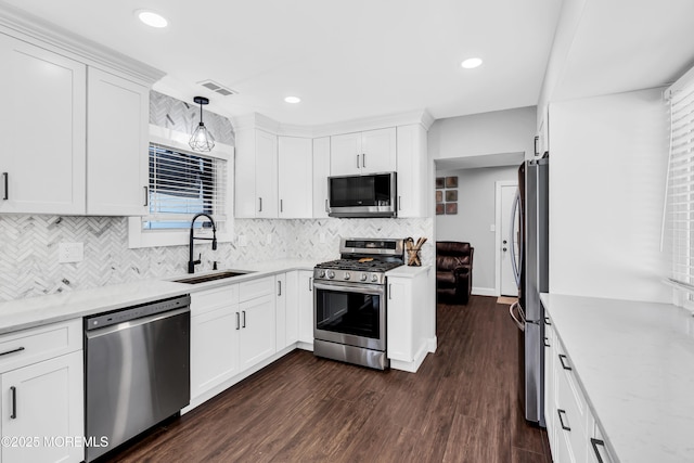 8 Blueberry Path, Howell, NJ 07731 - kitchen featuring stainless steel appliances, backsplash, white cabinets, dark wood-style flooring, and light stone counters