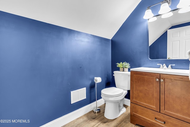 8 Blueberry Path, Howell, NJ 07731 - bathroom featuring vaulted ceiling, vanity, and wood finished floors