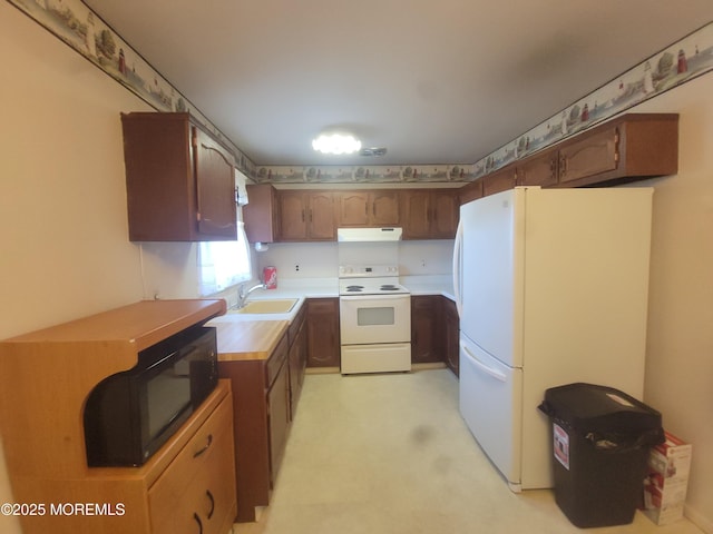 5B Lenape Dr, Whiting, NJ 08759 - kitchen featuring white appliances, under cabinet range hood, and light countertops