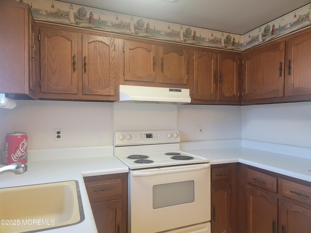 5B Lenape Dr, Whiting, NJ 08759 - kitchen featuring under cabinet range hood, white range with electric cooktop, light countertops, and brown cabinetry