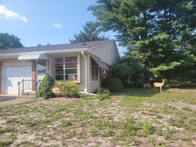 5B Lenape Dr, Whiting, NJ 08759 - view of property exterior featuring a garage and brick siding