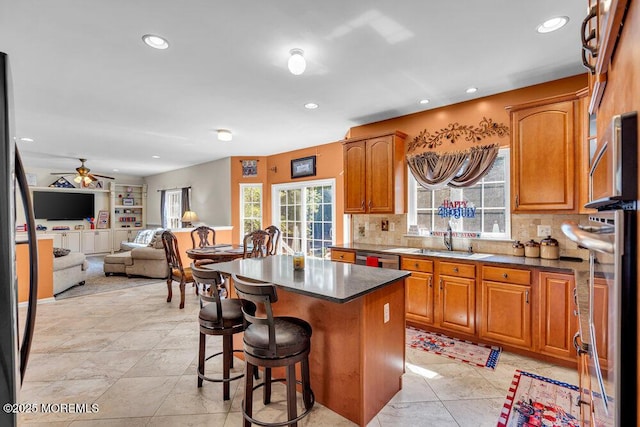 1 Opal Ct, Jackson, NJ 08527 - kitchen featuring a kitchen island, a breakfast bar area, backsplash, recessed lighting, and a ceiling fan