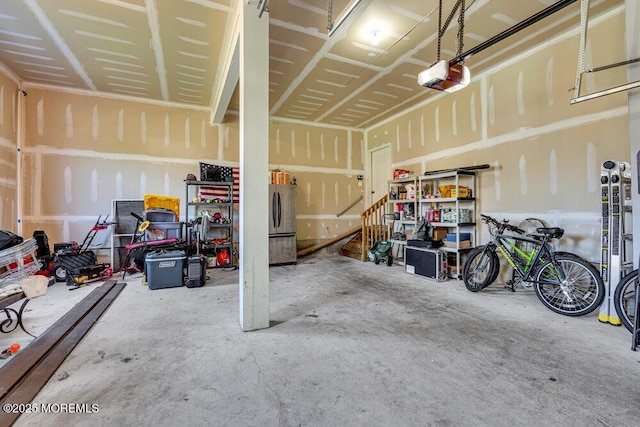 1 Opal Ct, Jackson, NJ 08527 - garage featuring a garage door opener and freestanding refrigerator