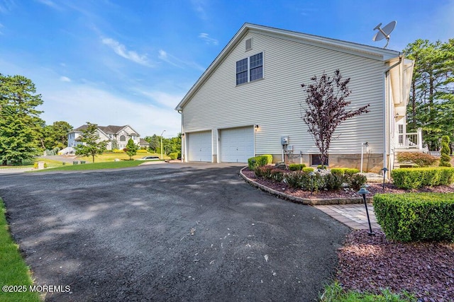 1 Opal Ct, Jackson, NJ 08527 - view of side of property with driveway and an attached garage