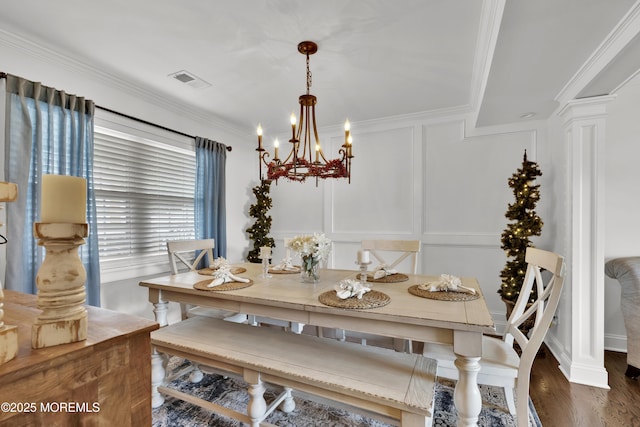 141 Twin Rivers Dr, Toms River, NJ 08753 - dining area featuring a chandelier, ornamental molding, dark wood-style flooring, a decorative wall, and decorative columns