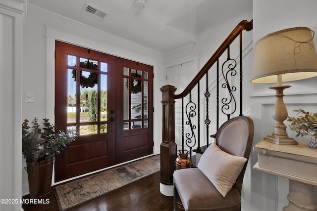 141 Twin Rivers Dr, Toms River, NJ 08753 - foyer entrance with dark wood finished floors, stairs, and ornamental molding