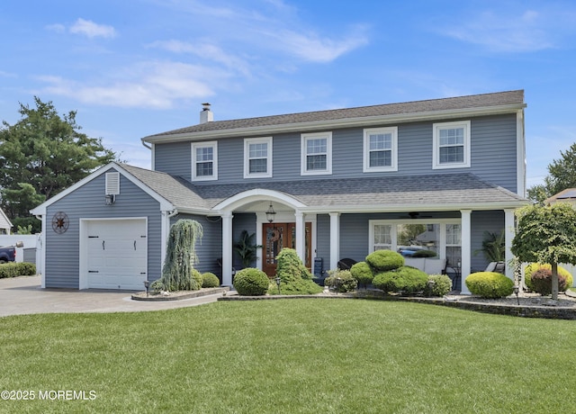 141 Twin Rivers Dr, Toms River, NJ 08753 - view of front of house featuring driveway, a garage, a chimney, and a front yard