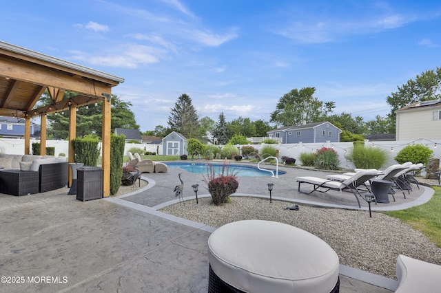 141 Twin Rivers Dr, Toms River, NJ 08753 - view of pool featuring a storage shed, a patio, an outdoor hangout area, and a fenced backyard
