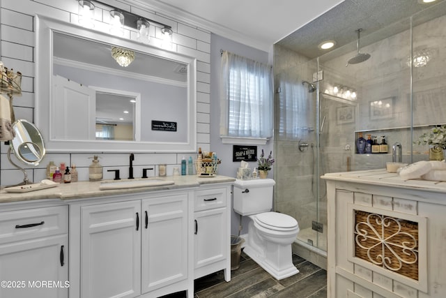 141 Twin Rivers Dr, Toms River, NJ 08753 - full bathroom with crown molding, vanity, a shower stall, and wood finished floors