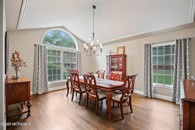 2 Independence Dr, Aberdeen, NJ 07747 - dining room with lofted ceiling, wood finished floors, and a chandelier