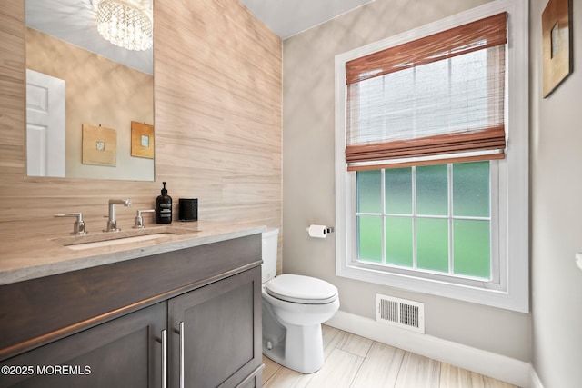 2 Independence Dr, Aberdeen, NJ 07747 - half bathroom featuring vanity, tasteful backsplash, and a chandelier