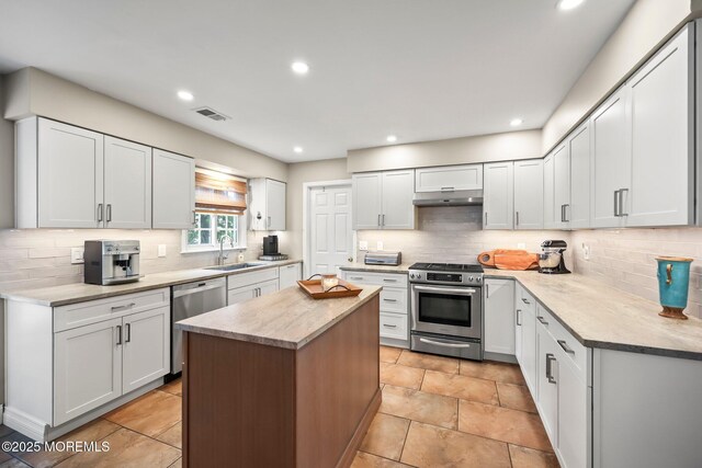 2 Independence Dr, Aberdeen, NJ 07747 - kitchen featuring stainless steel appliances, tasteful backsplash, a center island, and recessed lighting
