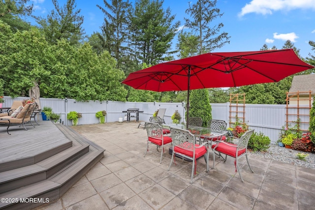 2 Independence Dr, Aberdeen, NJ 07747 - fenced backyard with outdoor dining area, a patio, a wooden deck, and a grill