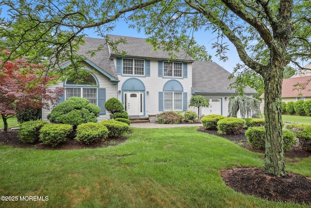 2 Independence Dr, Aberdeen, NJ 07747 - colonial house featuring roof with shingles, a garage, and a front yard