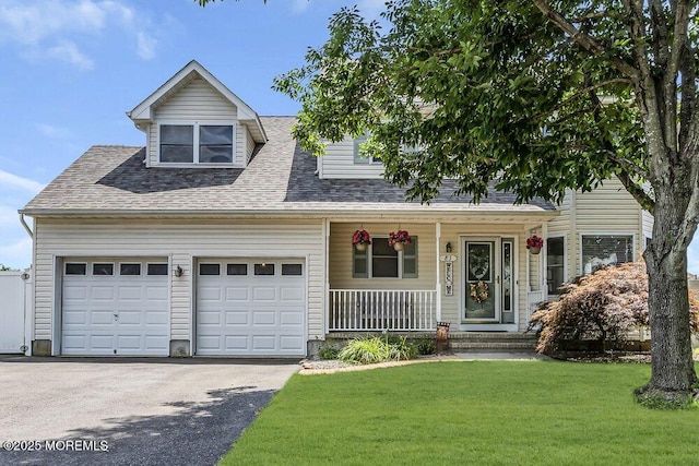 85 Mapletree Rd, Toms River, NJ 08753 - view of front of property featuring covered porch, asphalt driveway, a front yard, an attached garage, and roof with shingles