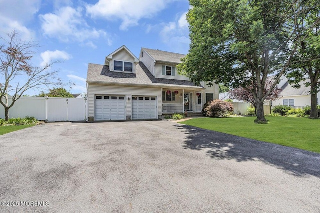85 Mapletree Rd, Toms River, NJ 08753 - traditional-style home featuring driveway, covered porch, and a gate
