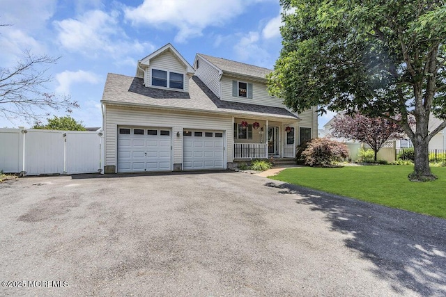 85 Mapletree Rd, Toms River, NJ 08753 - traditional-style home featuring a porch, asphalt driveway, a garage, a gate, and roof with shingles