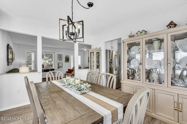 85 Mapletree Rd, Toms River, NJ 08753 - dining area with a chandelier and light wood-style flooring