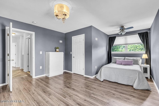 85 Mapletree Rd, Toms River, NJ 08753 - bedroom featuring wood finished floors, a chandelier, and a ceiling fan
