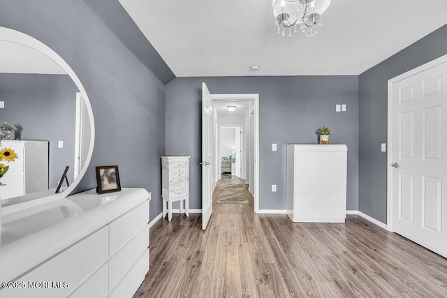 85 Mapletree Rd, Toms River, NJ 08753 - entrance foyer with wood finished floors, a chandelier, and arched walkways