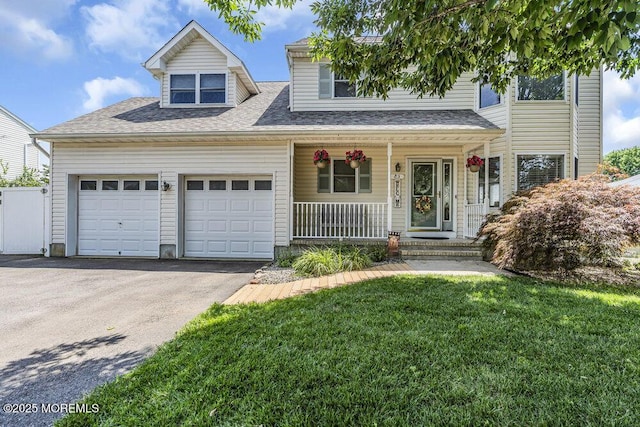 85 Mapletree Rd, Toms River, NJ 08753 - view of front facade with covered porch, asphalt driveway, a garage, a front lawn, and roof with shingles