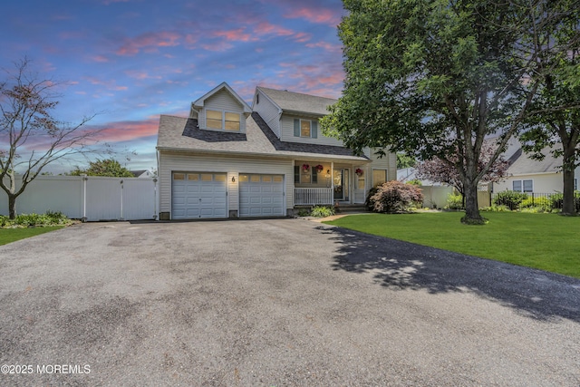85 Mapletree Rd, Toms River, NJ 08753 - traditional home featuring covered porch, asphalt driveway, a gate, a garage, and a shingled roof