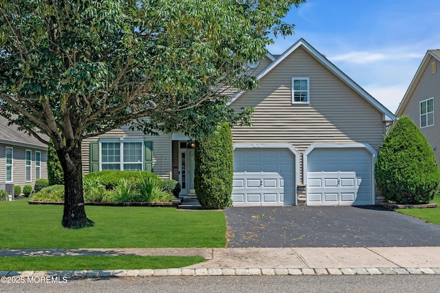 252 Enclave Blvd, Lakewood, NJ 08701 - view of property hidden behind natural elements featuring driveway, a front lawn, and an attached garage