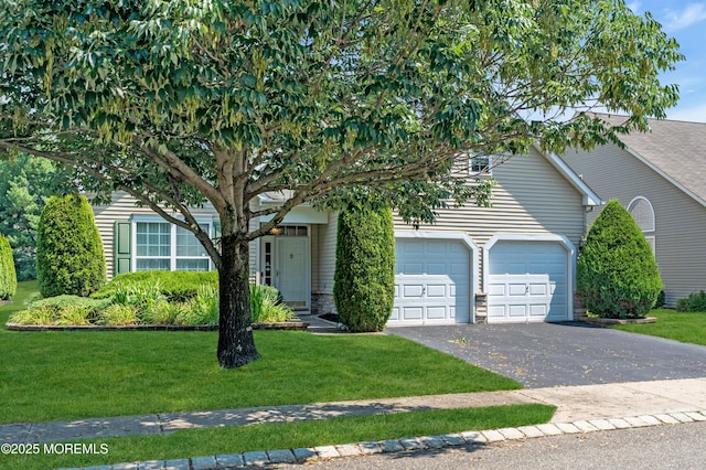 252 Enclave Blvd, Lakewood, NJ 08701 - view of property hidden behind natural elements with a garage, asphalt driveway, and a front lawn
