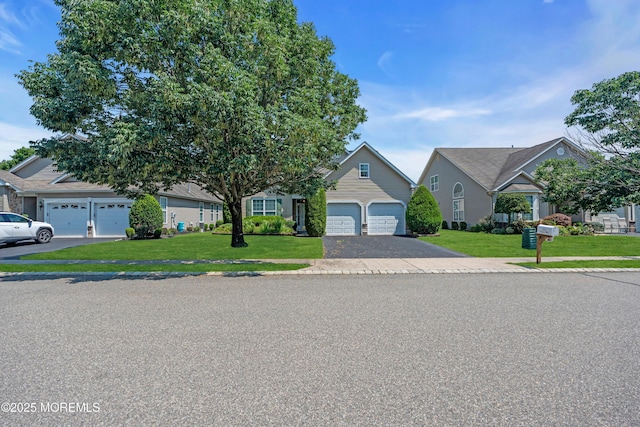 252 Enclave Blvd, Lakewood, NJ 08701 - obstructed view of property with driveway, a front lawn, and a garage