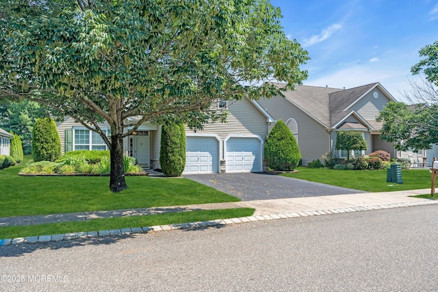 252 Enclave Blvd, Lakewood, NJ 08701 - obstructed view of property featuring driveway, a garage, and a front yard
