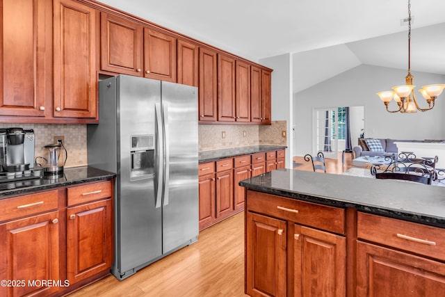 252 Enclave Blvd, Lakewood, NJ 08701 - kitchen featuring stainless steel refrigerator with ice dispenser, light wood finished floors, brown cabinets, and lofted ceiling