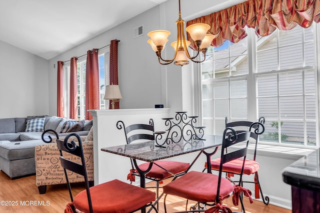 252 Enclave Blvd, Lakewood, NJ 08701 - dining space with wood finished floors and a chandelier
