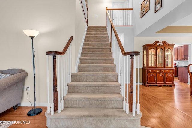 252 Enclave Blvd, Lakewood, NJ 08701 - stairway with wood finished floors and a high ceiling