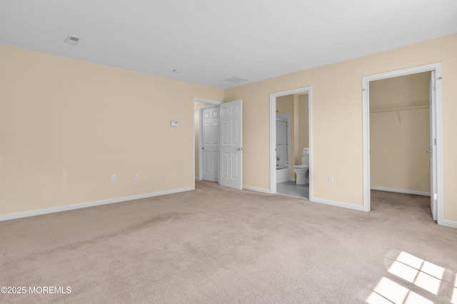 252 Enclave Blvd, Lakewood, NJ 08701 - unfurnished bedroom featuring light carpet, a spacious closet, ensuite bathroom, and a closet