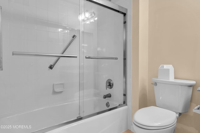 252 Enclave Blvd, Lakewood, NJ 08701 - bathroom featuring toilet and shower / bath combination with glass door