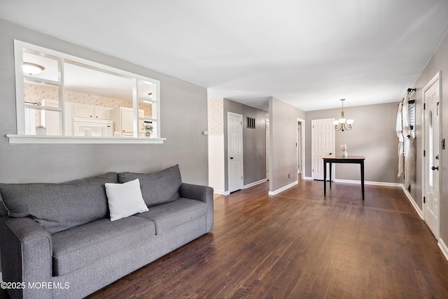 6 Redwood Rd, Howell, NJ 07731 - living room with a chandelier, dark wood-type flooring, and healthy amount of natural light