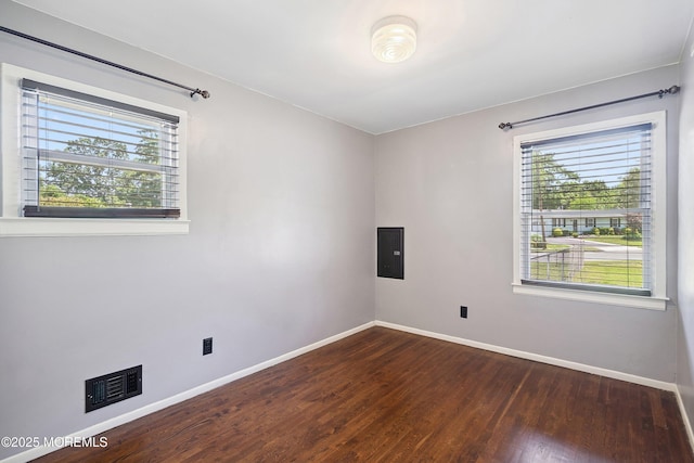 6 Redwood Rd, Howell, NJ 07731 - unfurnished room with healthy amount of natural light, electric panel, and dark wood-type flooring